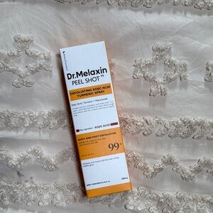 Exfoliating Kojic Acid Turmeric Spray - White and Orange